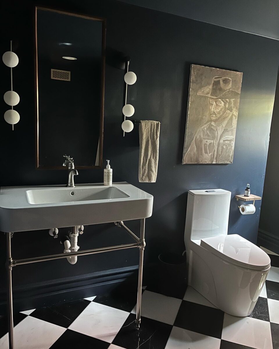 A moody basement bathroom renovation by Kirsten Grove